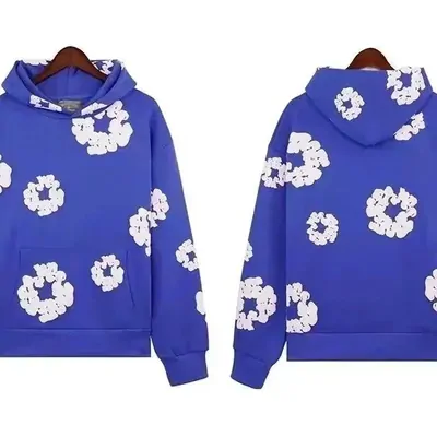 A royal blue hoodie shown from the front and the back on a plain background, printed all over with white flower motifs.